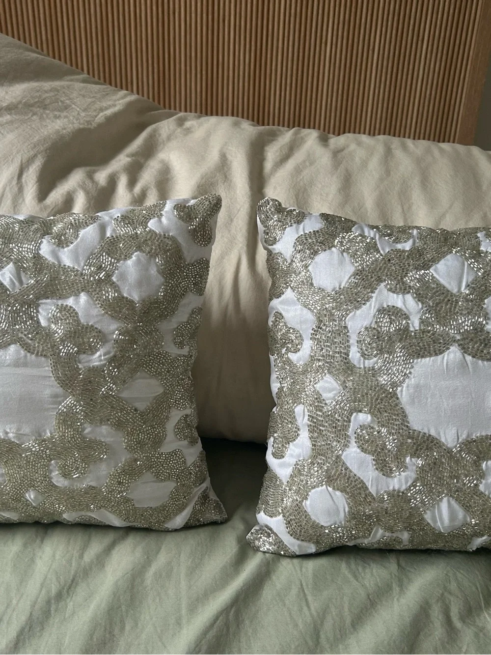 White Decorative Throw Pillow Pair with Beaded Silver Pattern